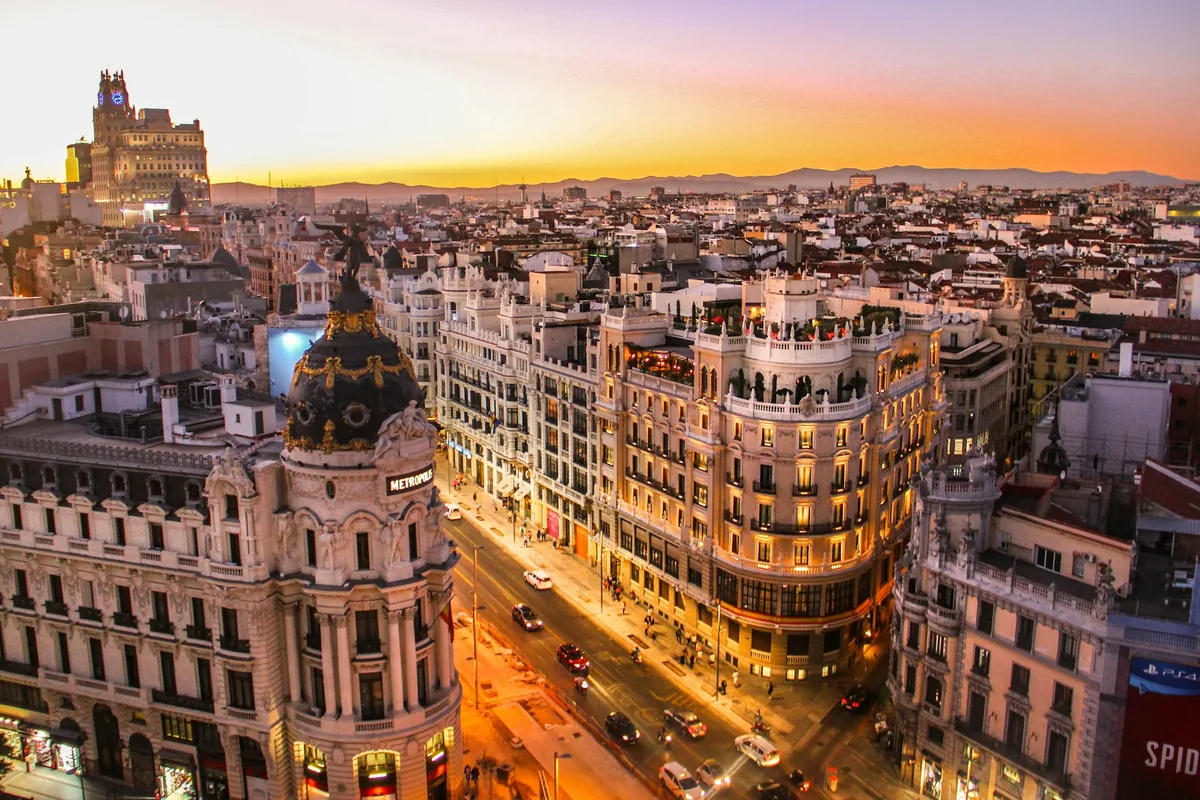 Gran Vía and the Metrópolis building in Madrid at sunset